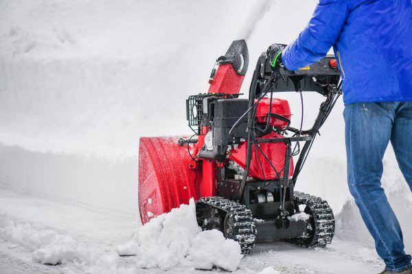 person-using-snowblower-to-remove-snow-e977b0a0f182486ab8f10bc9822b81da